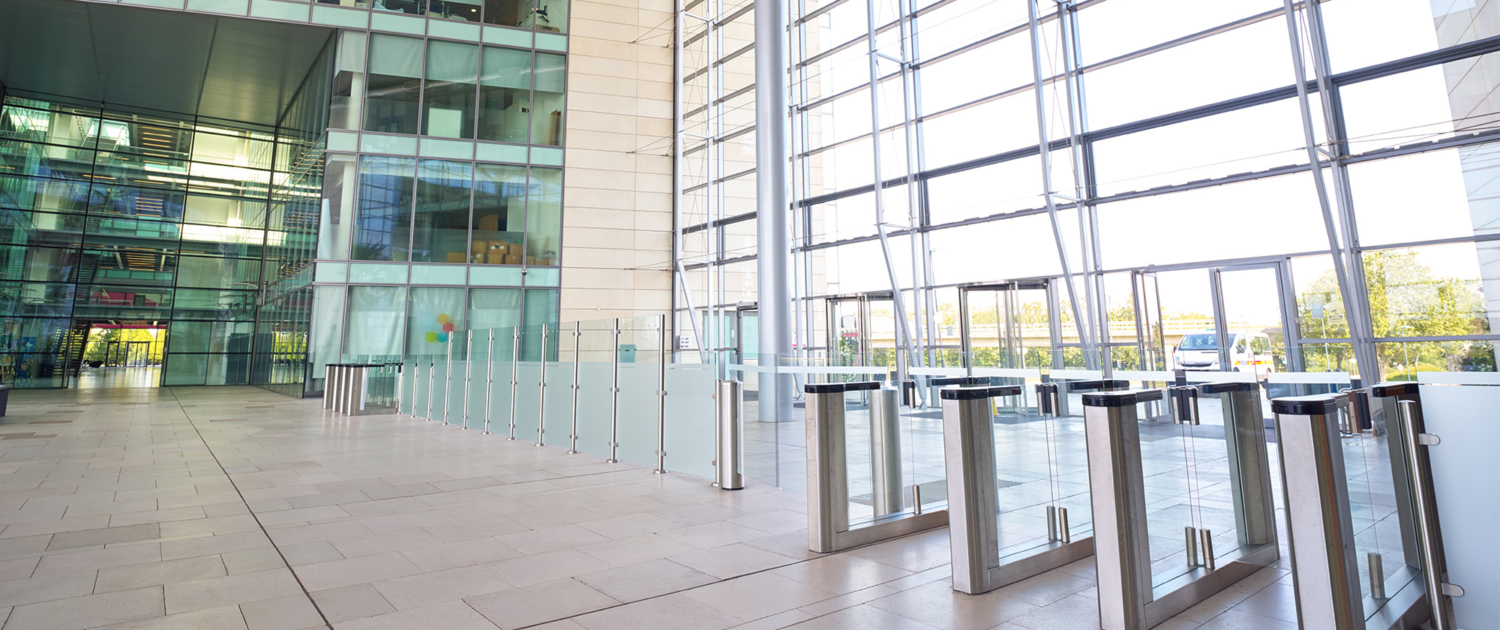 Interior View Of Modern Office Lobby With Security Check Barriers